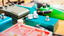 side view of a guitarist's pedals